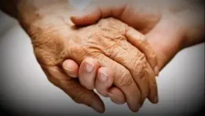 Photo of two hands clasped together